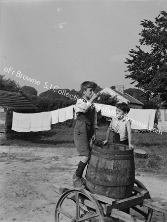 BOYS WITH WATER BARREL